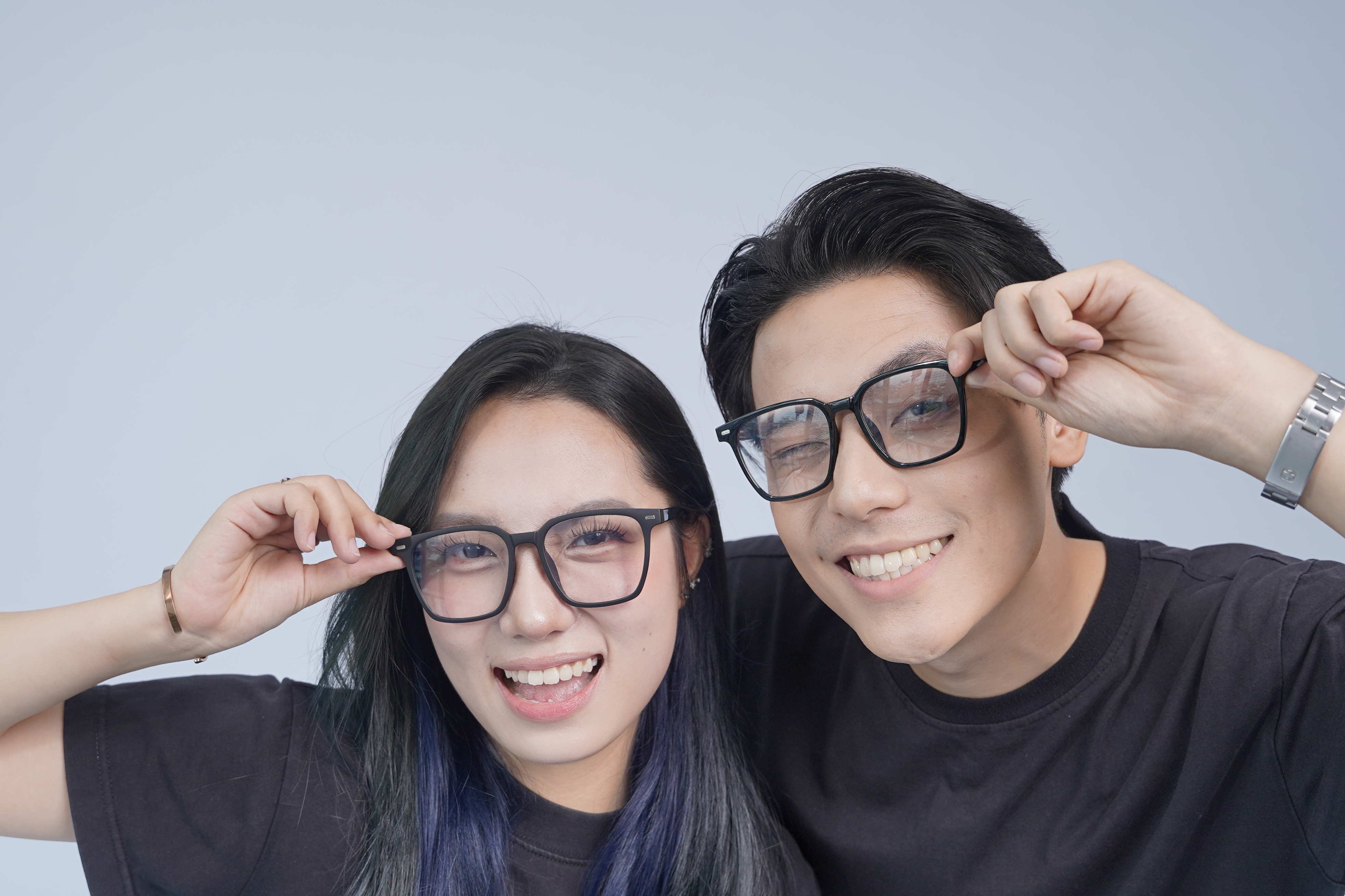 A person trying on glasses