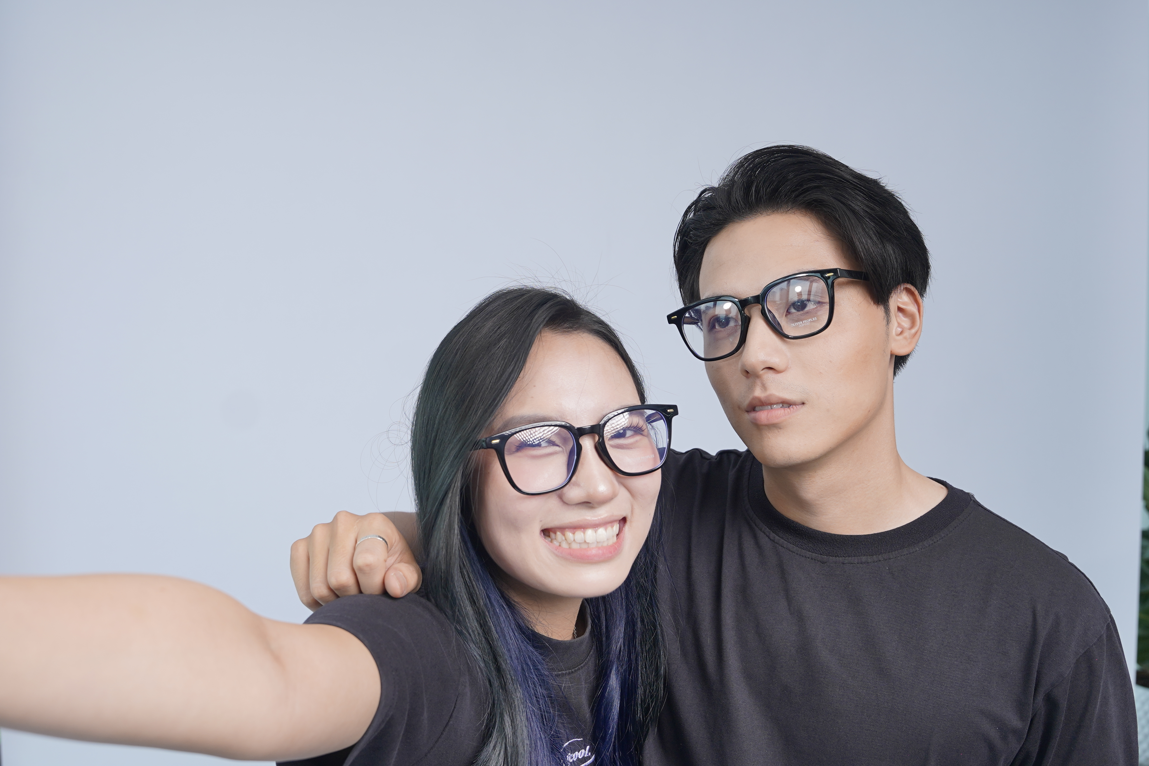 A person trying on different glasses